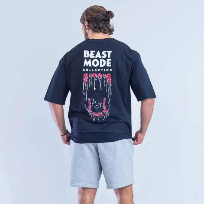 Navy tee worn from behind, Beast Mode Collection back print