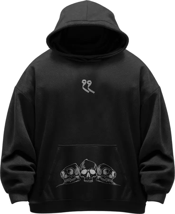 Black hoodie with a small chest mark and a tonal skull print at the hem