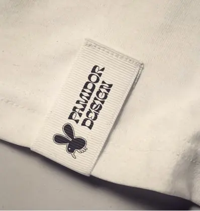 An embroidered Pamidor Design label on white fabric