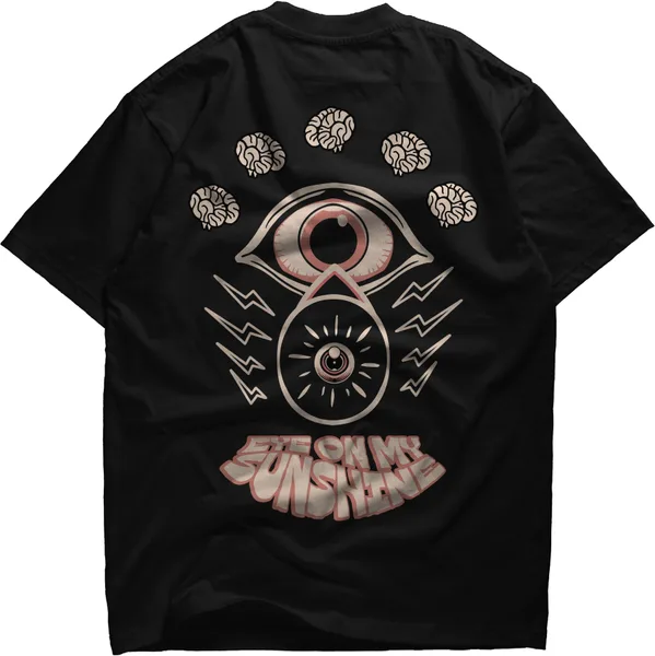 Black tee with an eye motif over a scatter of petals