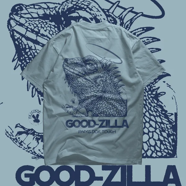 Pale blue Good-Zilla tee with a large line-drawn creature