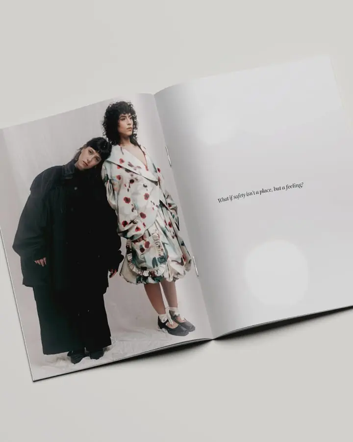 Open fashion editorial spread - a printed dress and a black coat