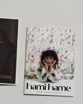 hami hame lookbook cover pinned to a wall, floral pattern