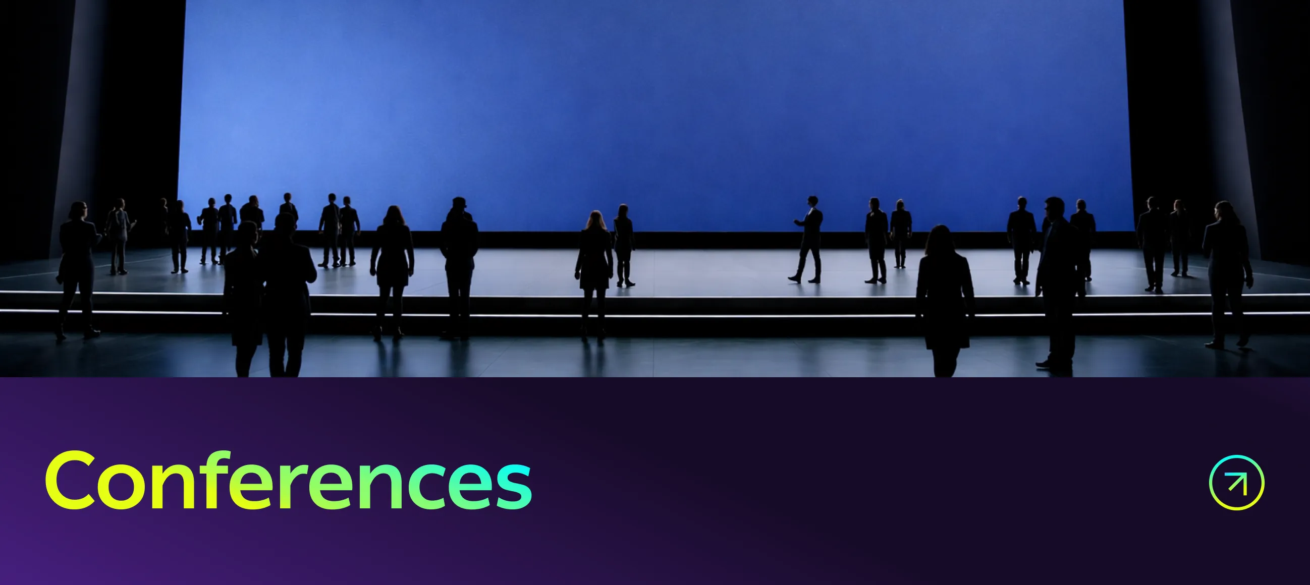 Conferences - silhouettes against a wide lit screen